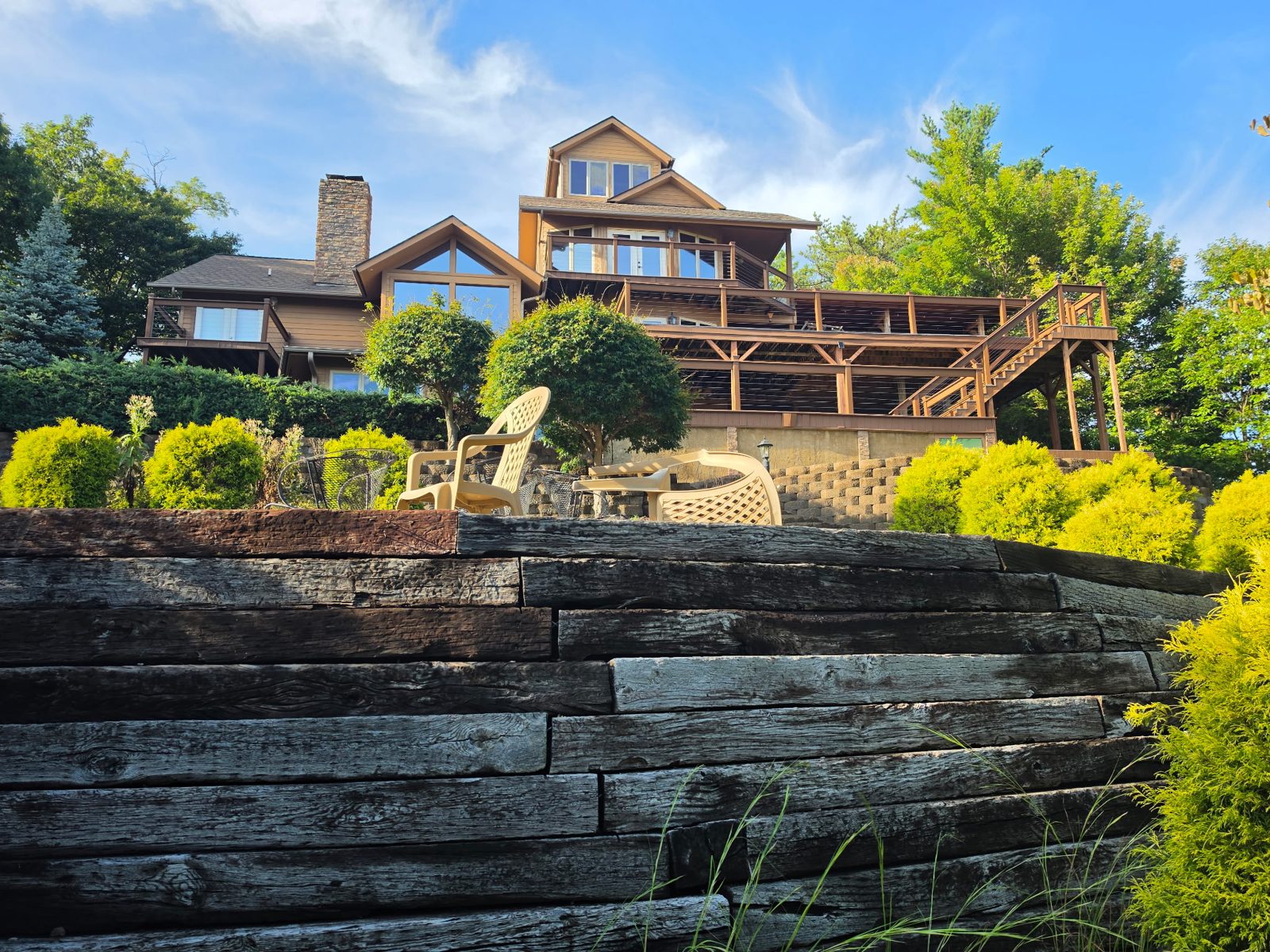 The cabin seen from below its retaining wall.