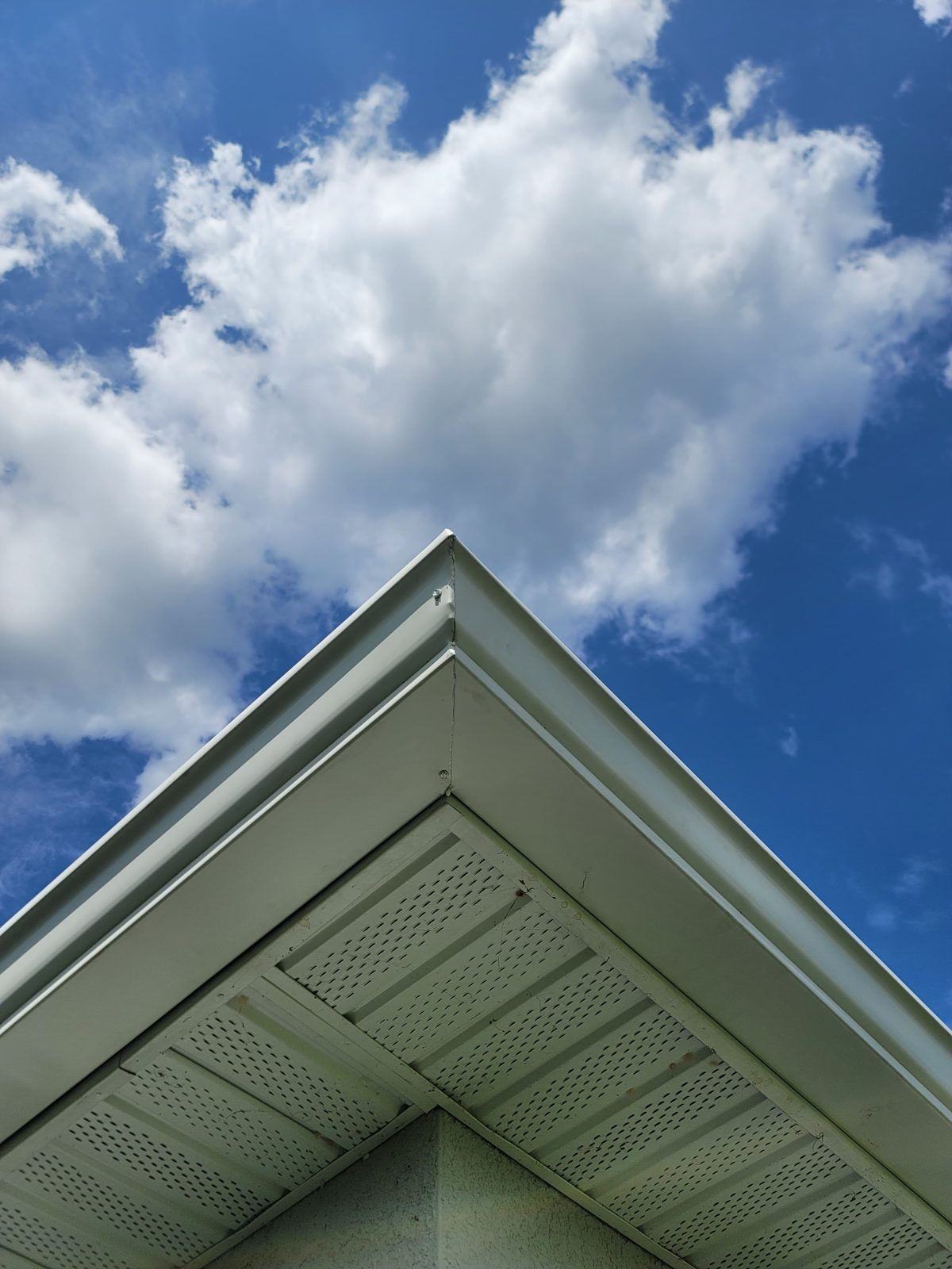 Finished fascia and soffit at a roof corner.