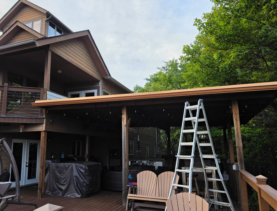 After: the same pergola roof edge with its new gutter.