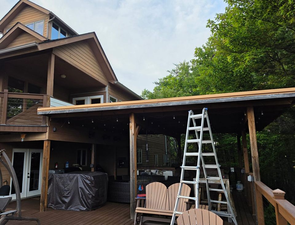 Before: an old, dark gutter sagging along the pergola roof edge.